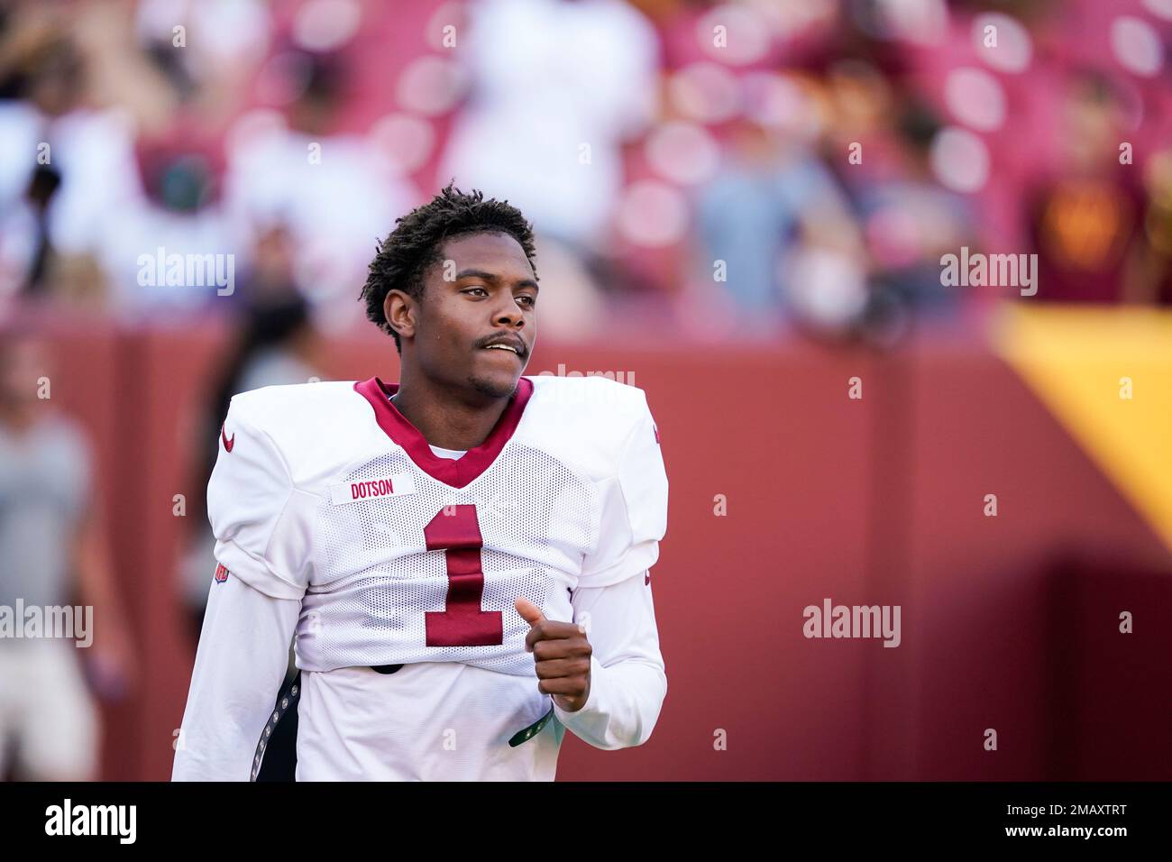 Washington Commanders wide receiver Jahan Dotson (1) arrives for an NFL