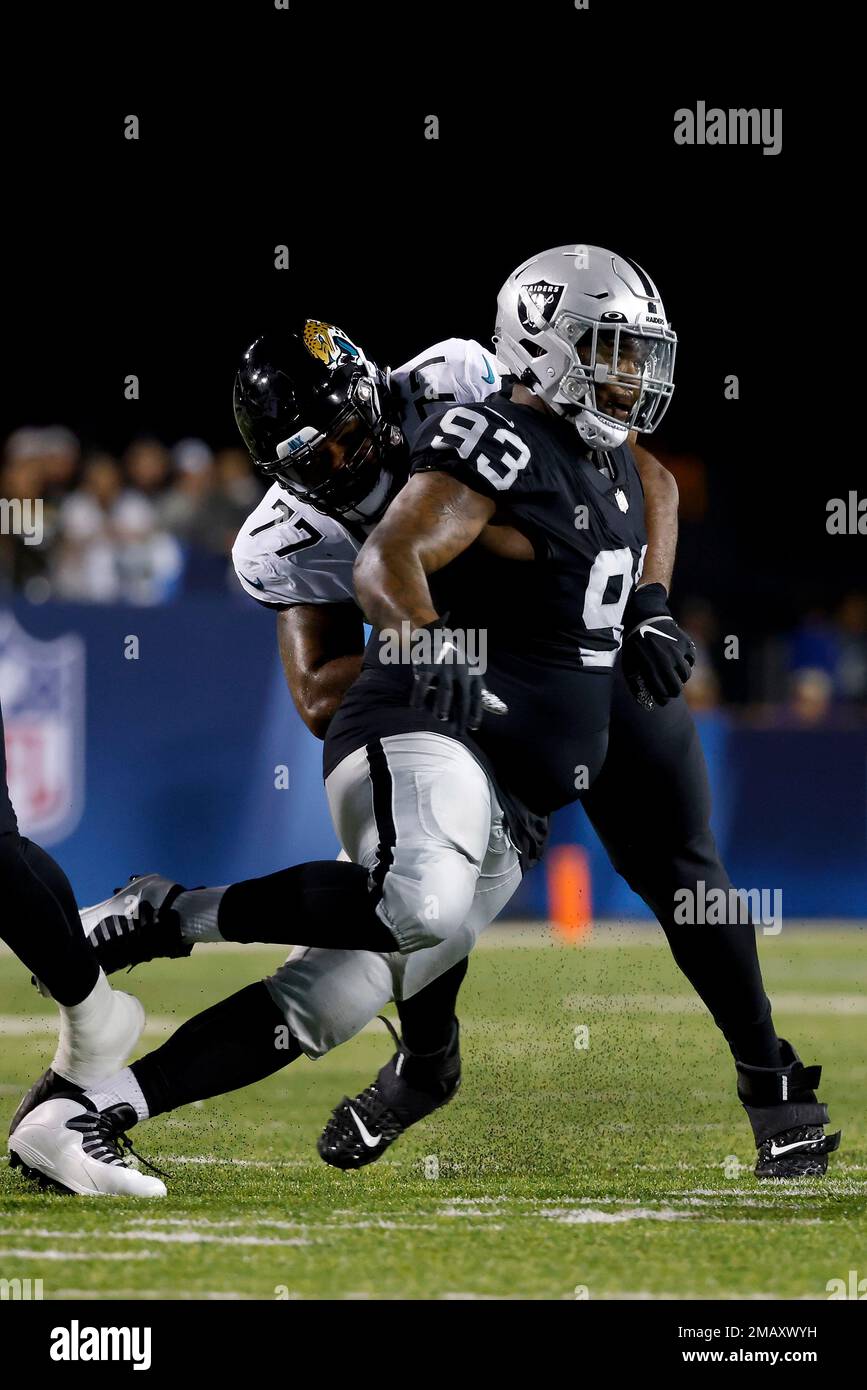 Jacksonville Jaguars center Nick Ford (77) looks at the video screen from  the sidelines during the second half of an NFL preseason football game  against the Cleveland Browns, Friday, Aug. 12, 2022