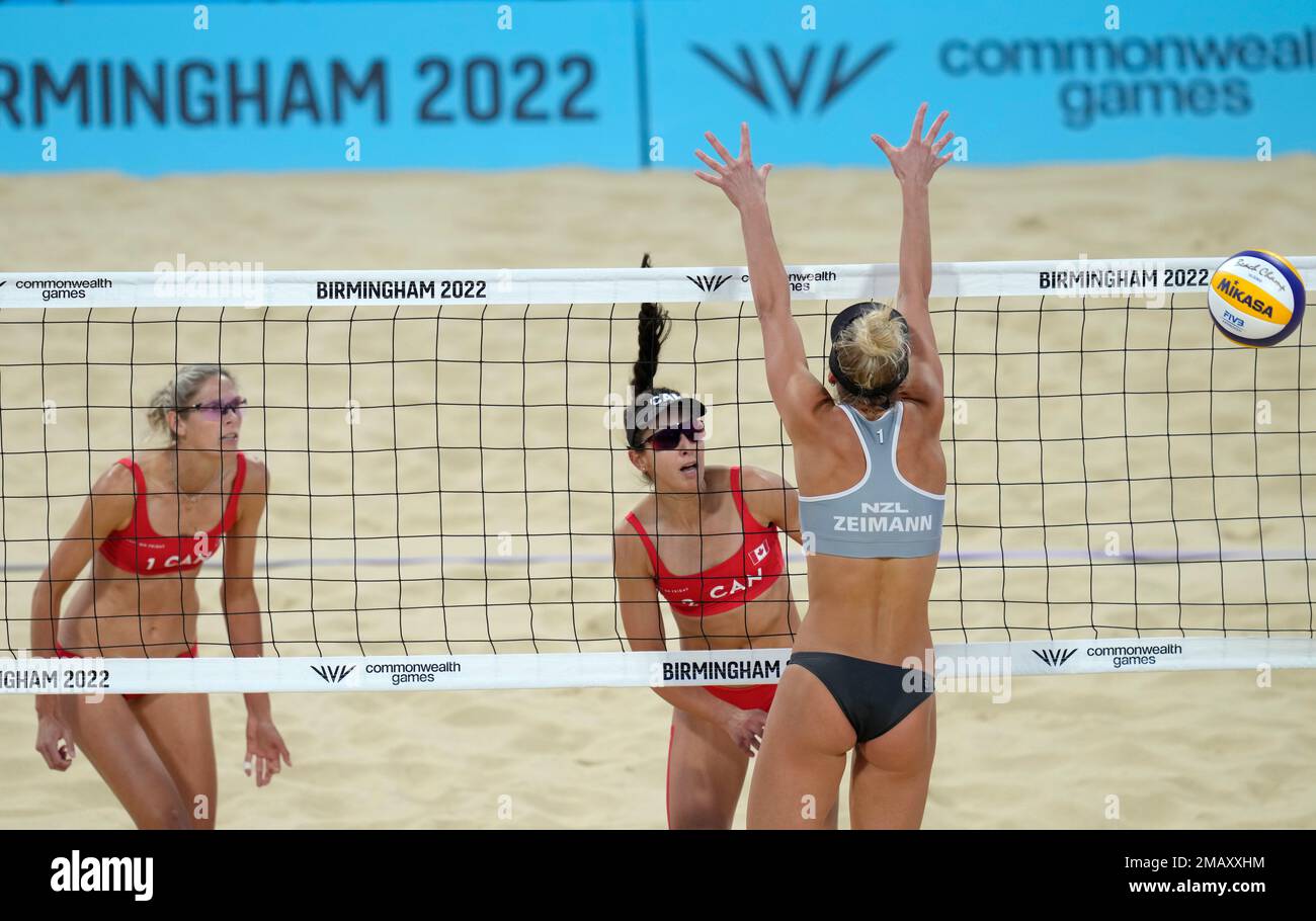 Sarah Pavan and Melissa Humana-Paredes of Canada play a return to Alice Zeimann and Shaunna Polley of New Zealand during the semifinal Beach Volleyball match between Canada and New Zealand at the