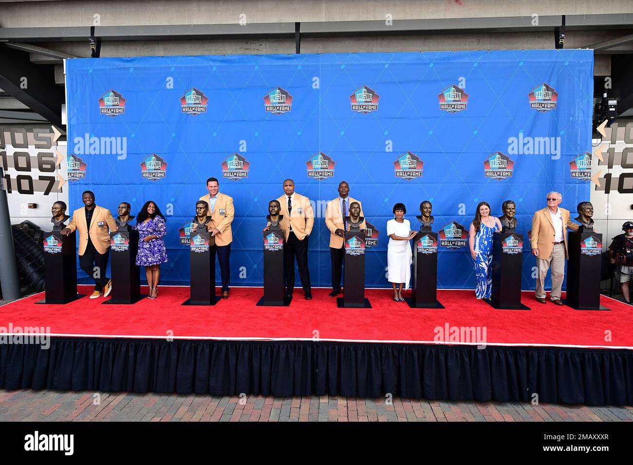 The Pro Football Hall of Fame class of 2022 pose with their busts following  an induction ceremony at the Pro Football Hall of Fame, Saturday, Aug. 6,  2022, in Canton, Ohio. From