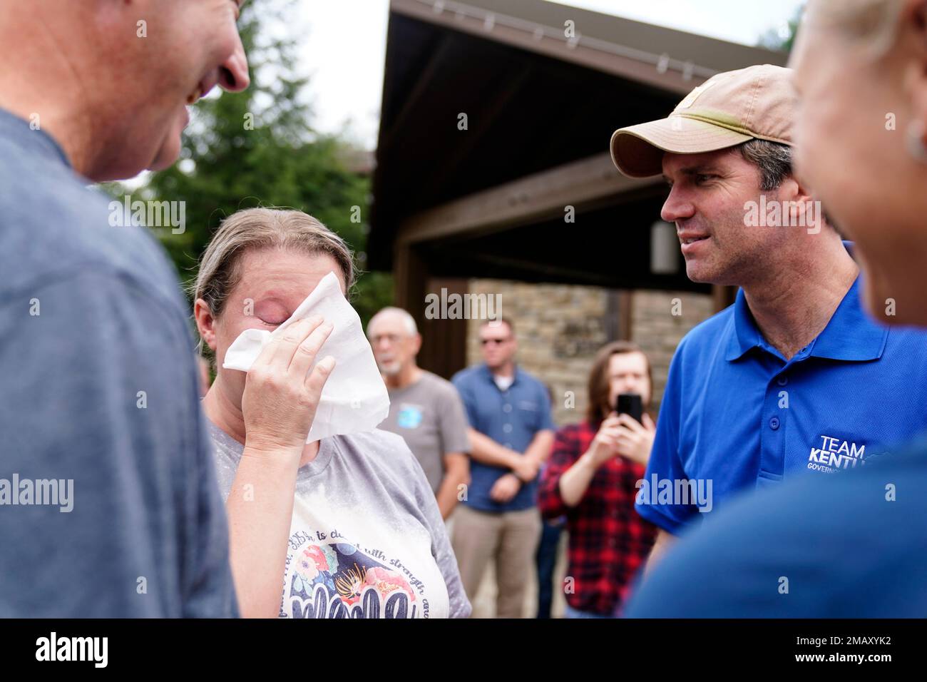 Kentucky Governor Andy Beshear, right, talks with Samantha Rowe, of