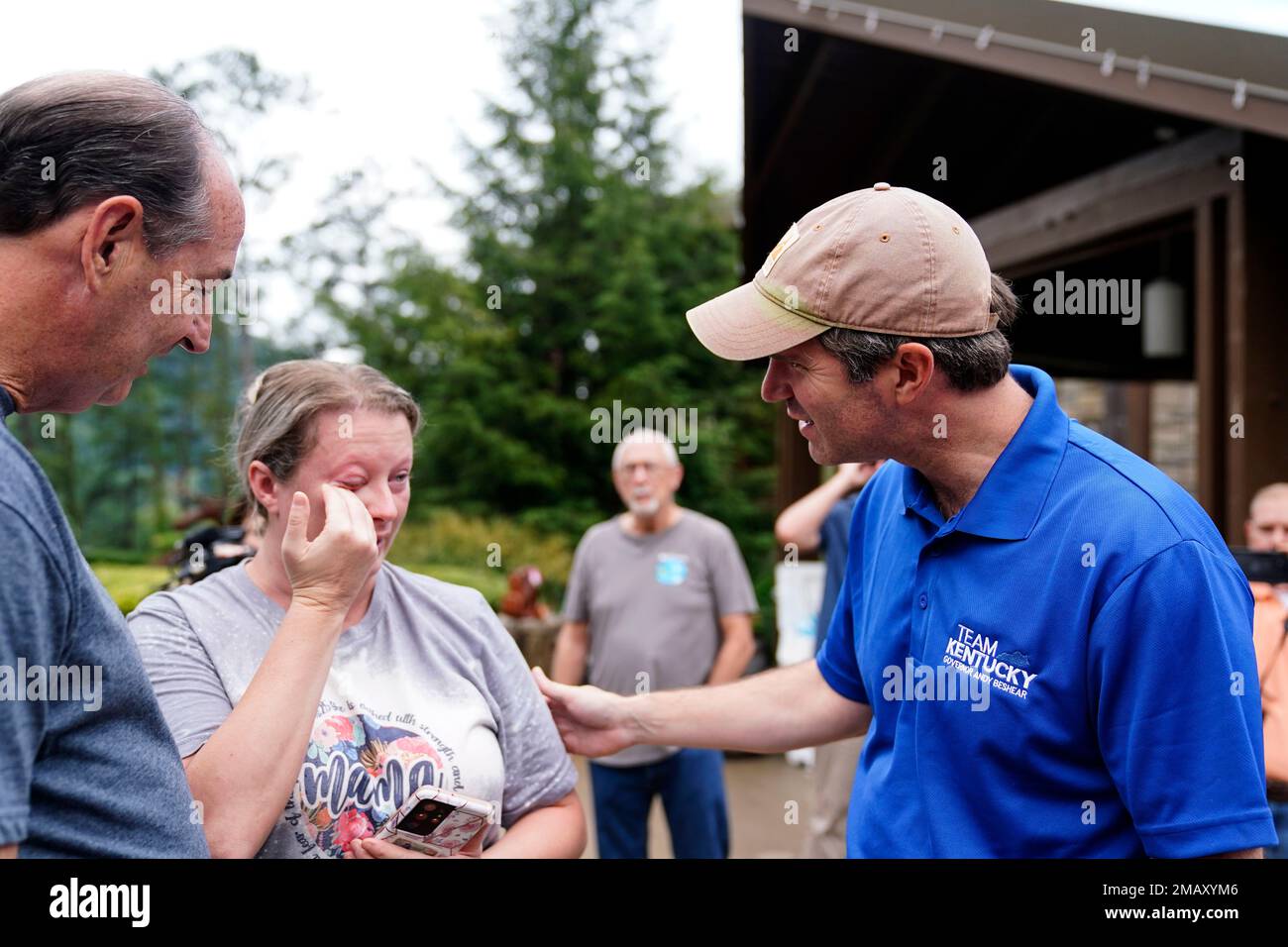Kentucky Governor Andy Beshear, right, talks with Samantha Rowe, of
