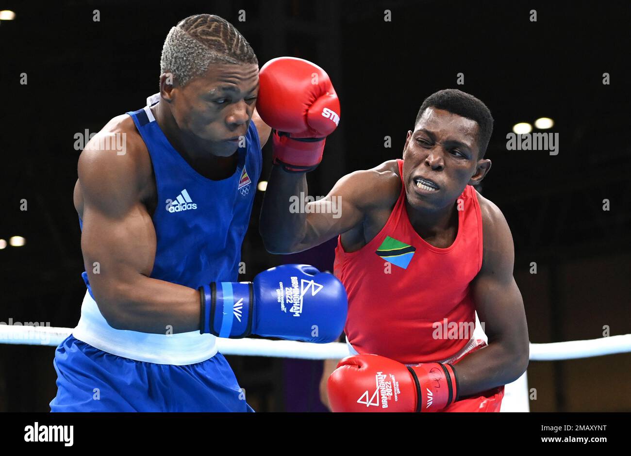 Tanzanias Kassim Mbundwike, right, and Mozambiques Tiago Osorio Muxanga compete during the Mens Light Middle semifinal boxing bout at the Commonwealth Games in Birmingham, England, Saturday, Aug