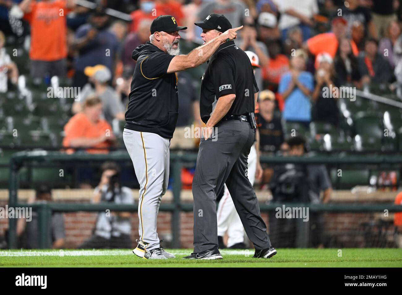 Pittsburgh Pirates manager Derek Shelton argues with first base umpire