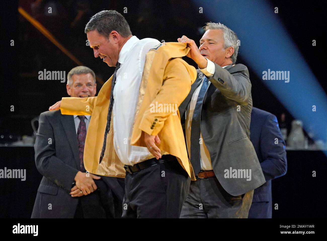 Former NFL player Tony Boselli, right, and presenter Mark Brunell pose with  his bust during an induction ceremony at the Pro Football Hall of Fame in  Canton, Ohio, Saturday, Aug. 6, 2022. (