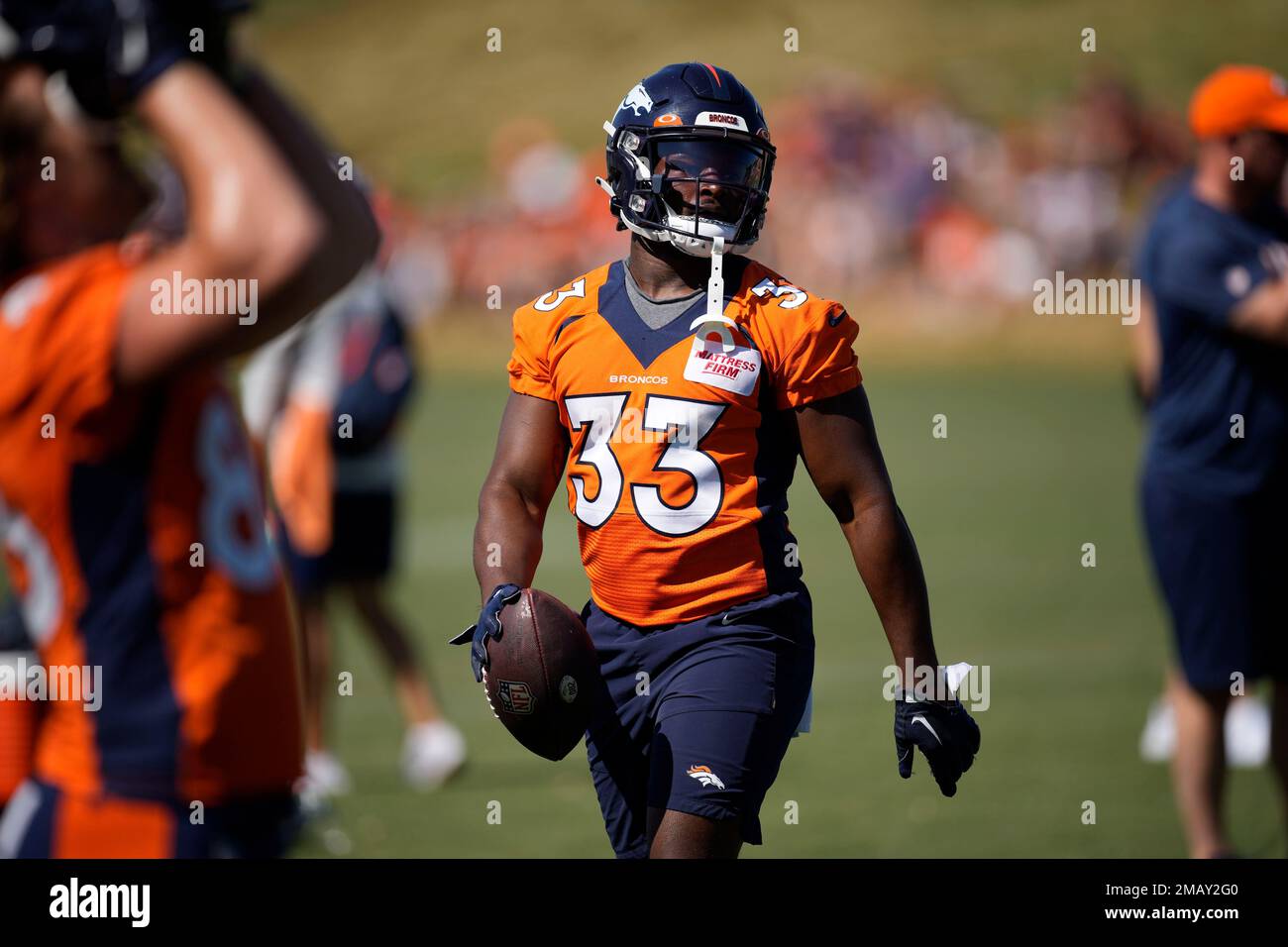 Denver Broncos running back Javonte Williams (33) takes part in drills