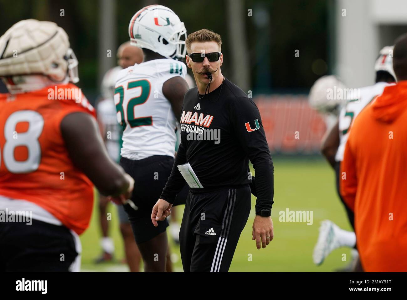 Miami strength coach Aaron Feld supervises the warm up period at the team's  NCAA college football facility, Friday, Aug. 5, 2022, in Coral Gables, Fla.  (AP Photo/Marta Lavandier Stock Photo - Alamy