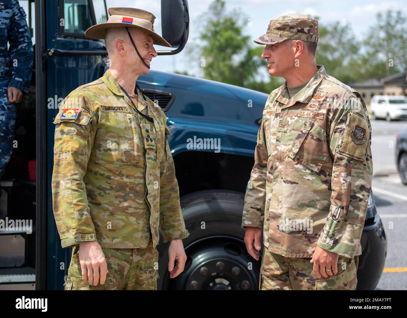 Col. Matt Husemann, right, 436th Airlift Wing commander, greets