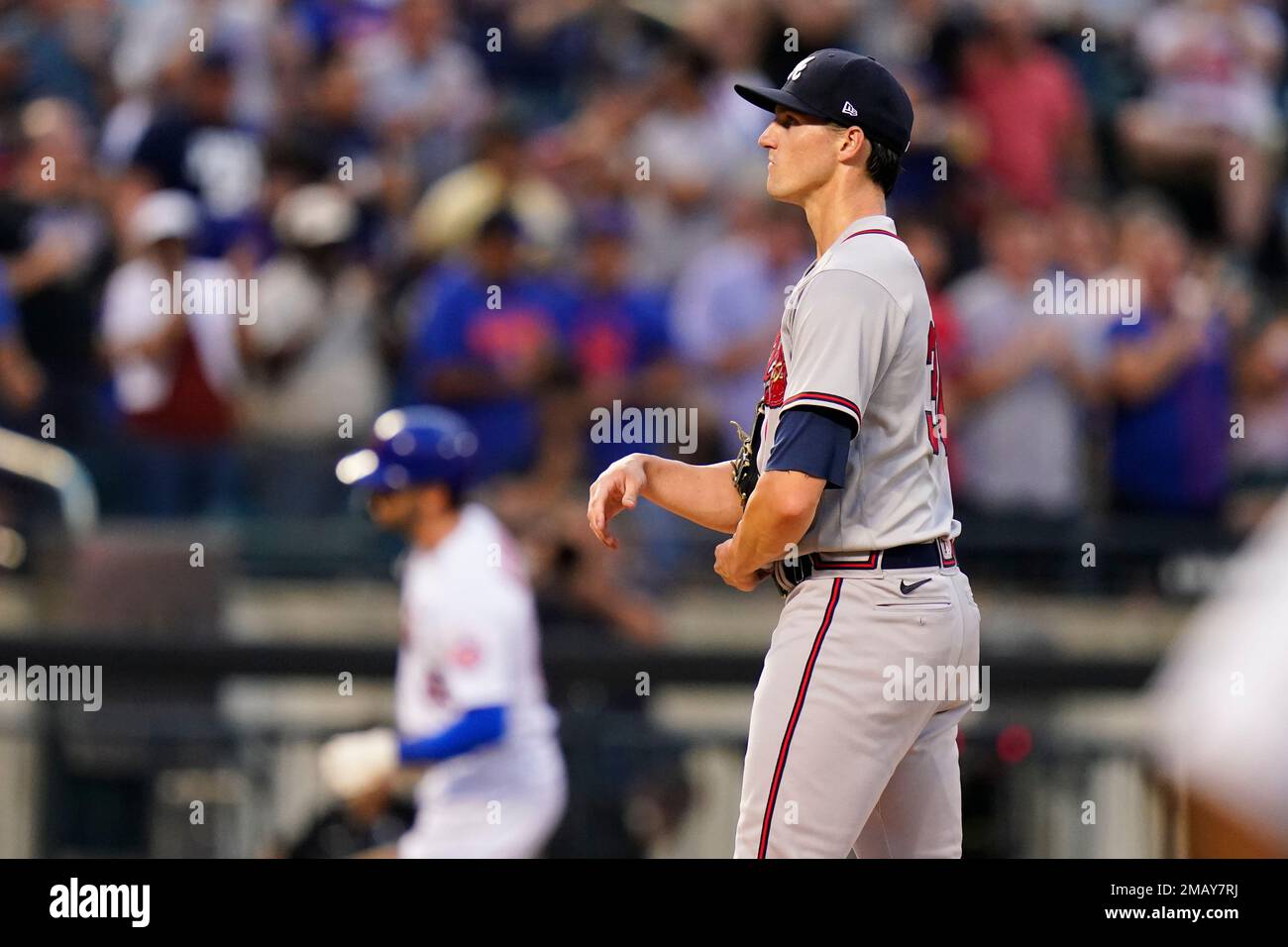 Atlanta Braves starting pitcher Kyle Wright, right, waits as New York