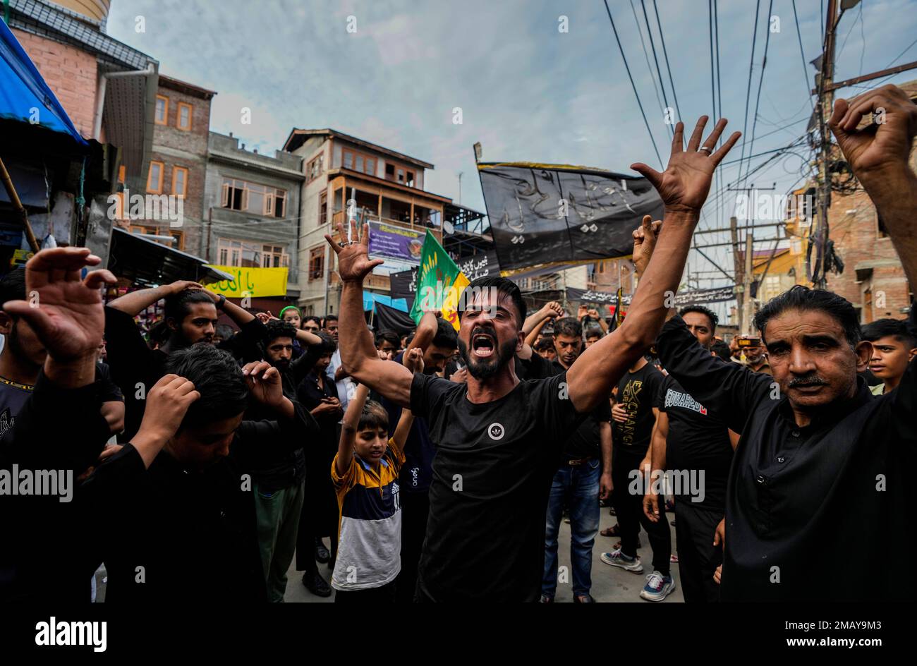 A Kashmiri Shiite Muslim shouts religious slogans during a Muharram ...