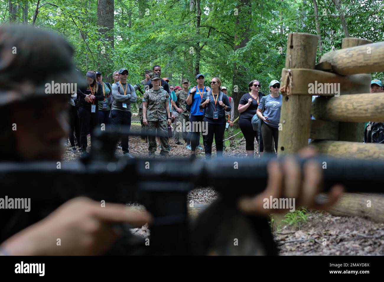 Educators from across the Nation watch Marines execute the Quigley obstacle course at the