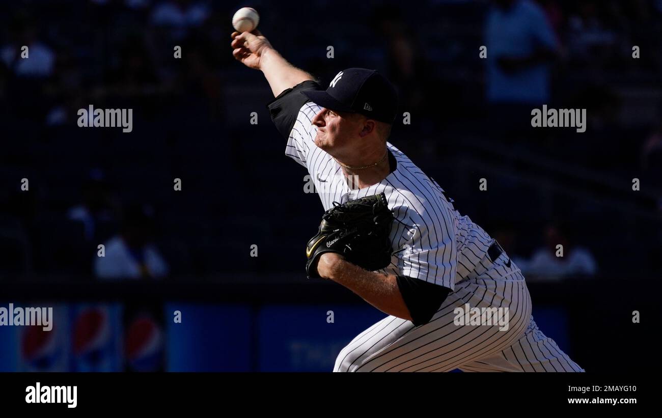New York Yankees pitcher Clarke Schmidt delivers against the Kansas