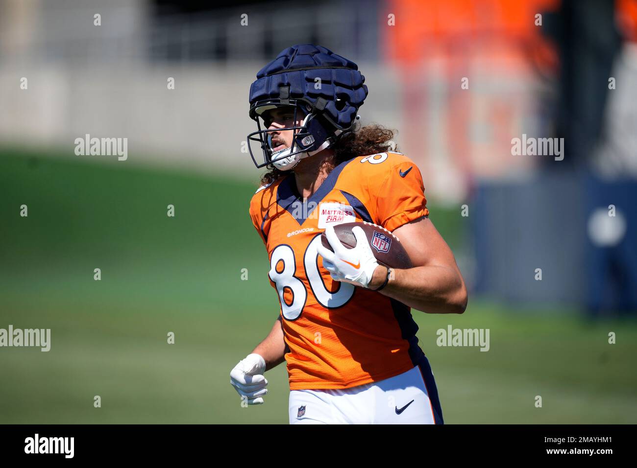 Denver Broncos rookie tight end Greg Dulcich takes part in drills