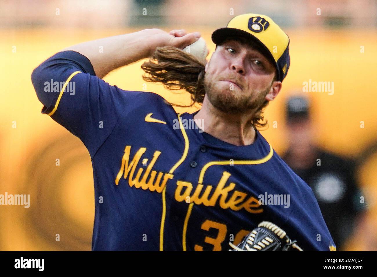 Milwaukee Brewers' Corbin Burnes adjusts his hair during the sixth