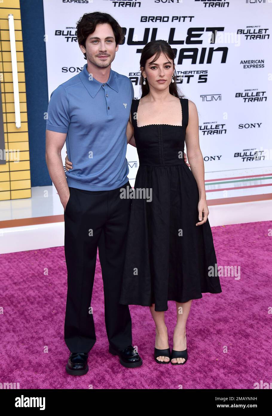 Ann Corrigan, right, and Logan Lerman arrive at the premiere of "Bullet