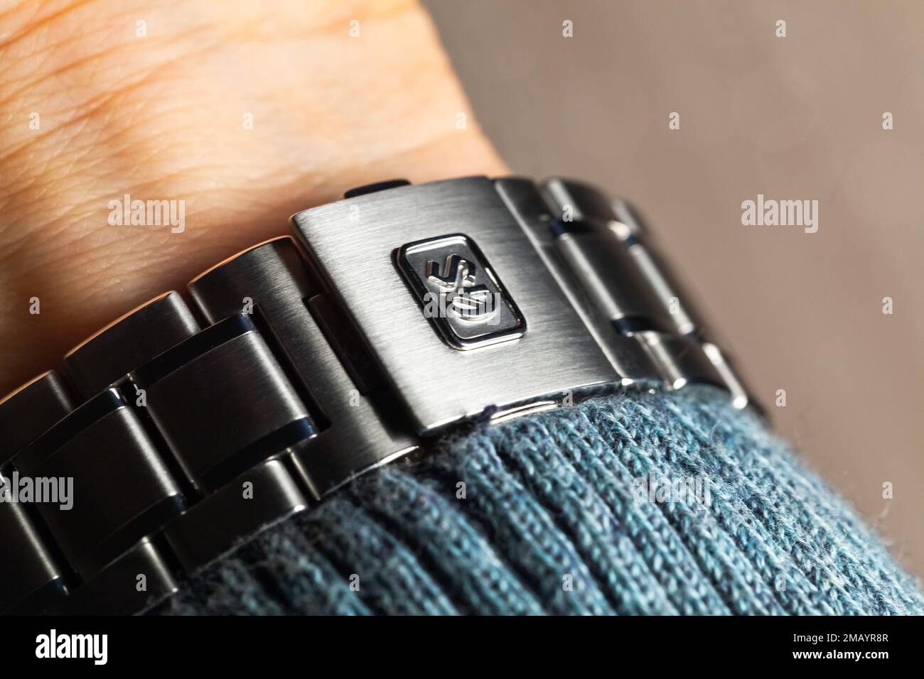 Tokyo, Japan - September 19, 2022: Steel bracelet of automatic wrist watch with Grand Seiko logotype Stock Photo