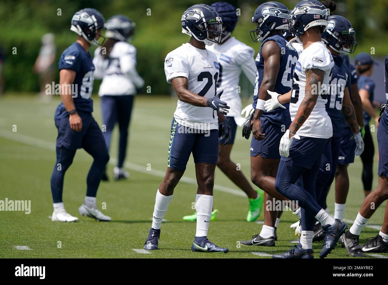 Seattle Seahawks cornerback Artie Burns, center, talks with teammates