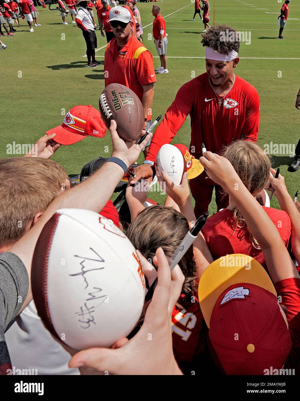 Kansas City Chiefs quarterback Patrick Mahomes signs autographs during