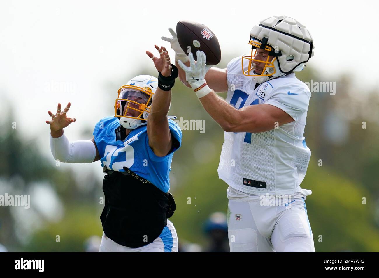 Los Angeles Chargers safety Alohi Gilman (32) and tight end Erik  Krommenhoek (84) participate in drills