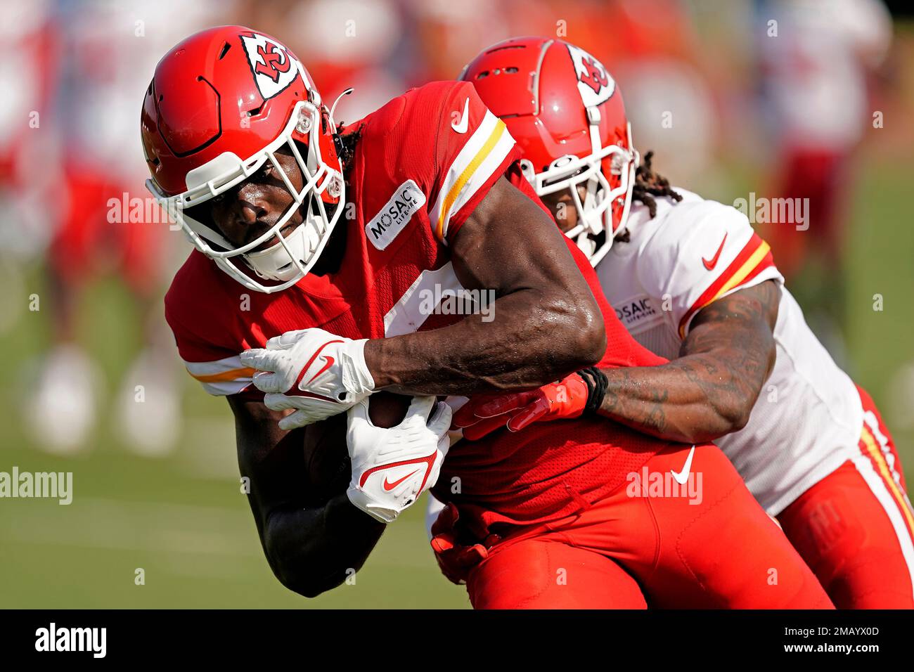 Kansas City Chiefs wide receiver Gary Jennings, left, is caught by  cornerback Lonnie Johnson during NFL football training camp Monday, Aug. 1,  2022, in St. Joseph, Mo. (AP Photo/Charlie Riedel Stock Photo 