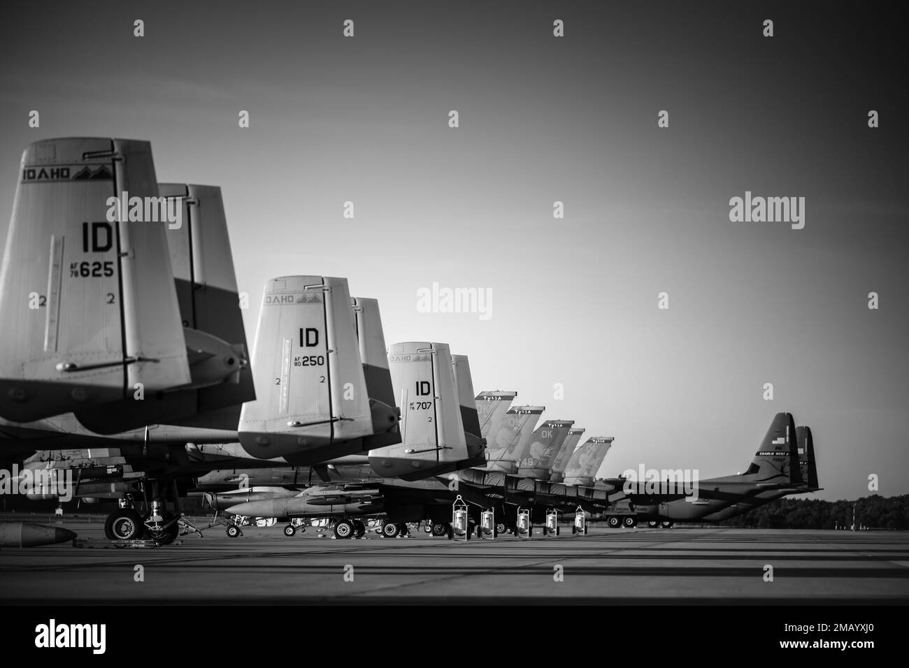 U.S. Air Force C-130 Hercules aircraft from the 130th Airlift Wing, McLaughlin Air National Guard Base, Charleston, West Virginia, A-10 Thunderbolt II aircraft from the 124th Fighter Wing, Gowen Field Air National Guard Base, Boise, Idaho, and F-16 Fighting Falcon aircraft, assigned to the Ohio Air National Guard’s 180th Fighter Wing, Swanton, Ohio, are parked on the flightline during Agile Rage 22 at Alpena Combat Readiness Training Center in Alpena, Mich., June 8, 2022. Agile Rage 22 is a National Guard Bureau-led exercise that provides realistic training opportunities, mimicking current and Stock Photo