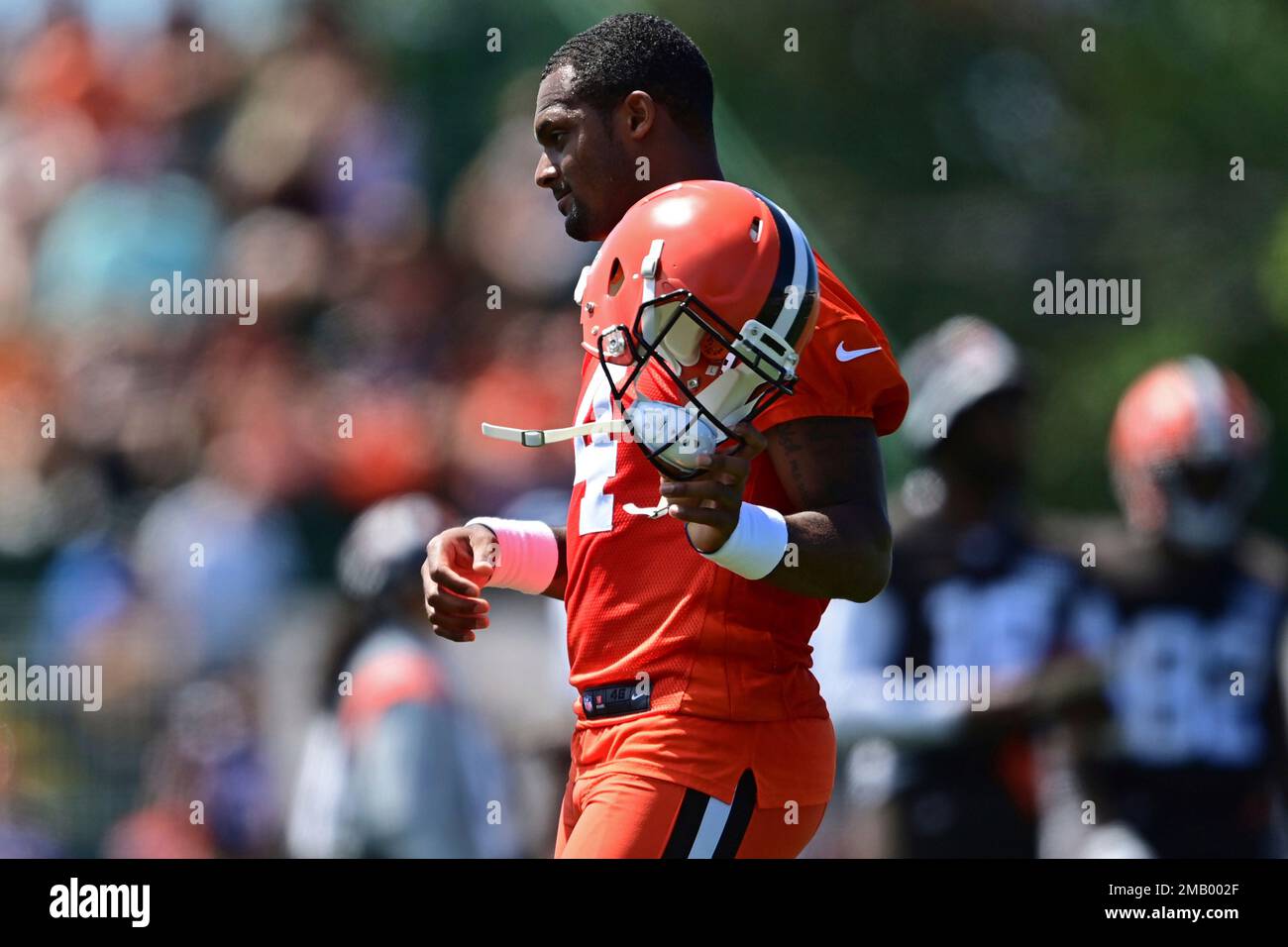 Cleveland Browns quarterback Deshaun Watson removes his helmet during