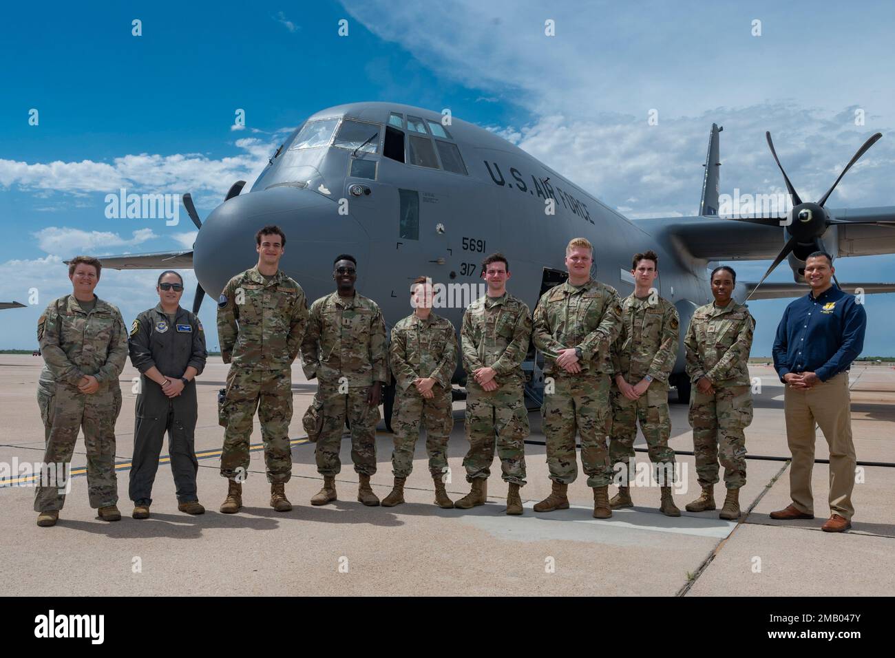 U.S. Air Force Academy cadets pose in front of a C130 Hercules