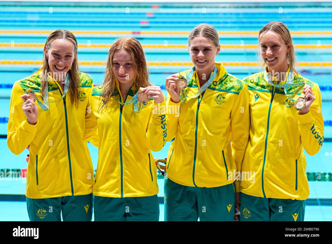 Swimmers of team Australia pose after winning the gold medal in the