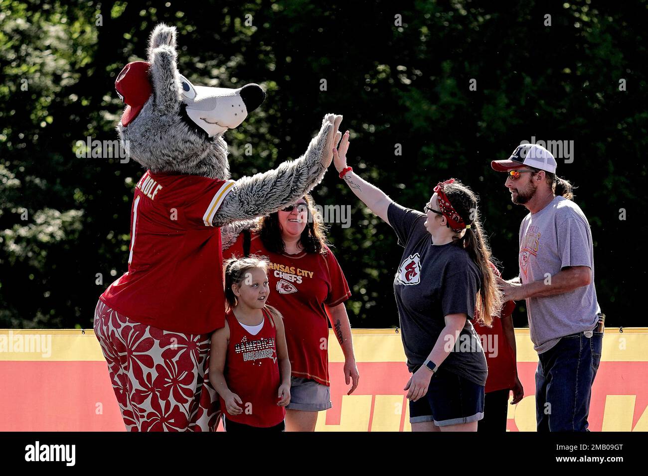 People greet Kansas City Chiefs mascot KC Wolf at NFL football training
