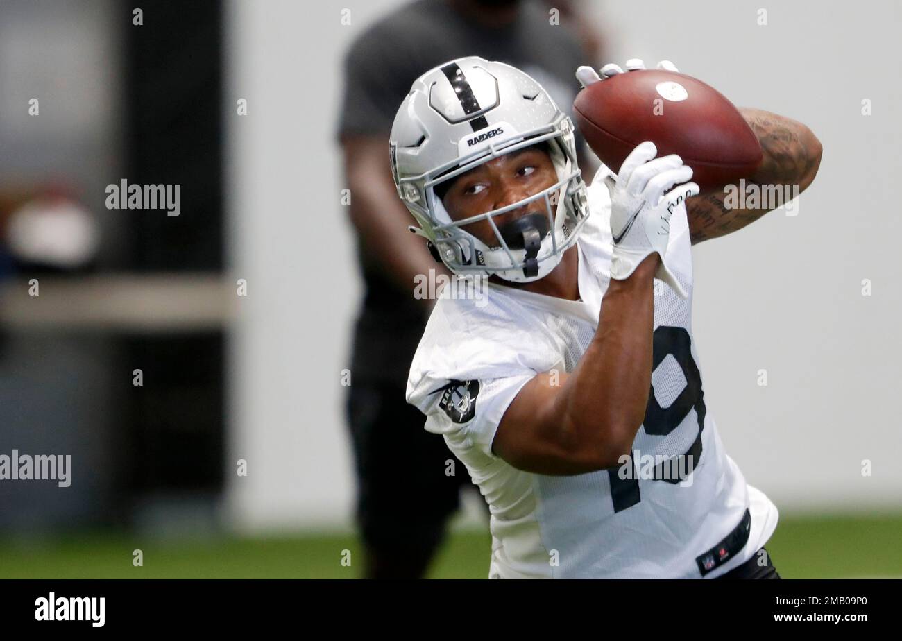 Las Vegas Raiders wide receiver DJ Turner (19) catches a pass during NFL  football training camp Saturday, July 30, 2022, in Henderson, Nev. (AP  Photo/Steve Marcus Stock Photo - Alamy