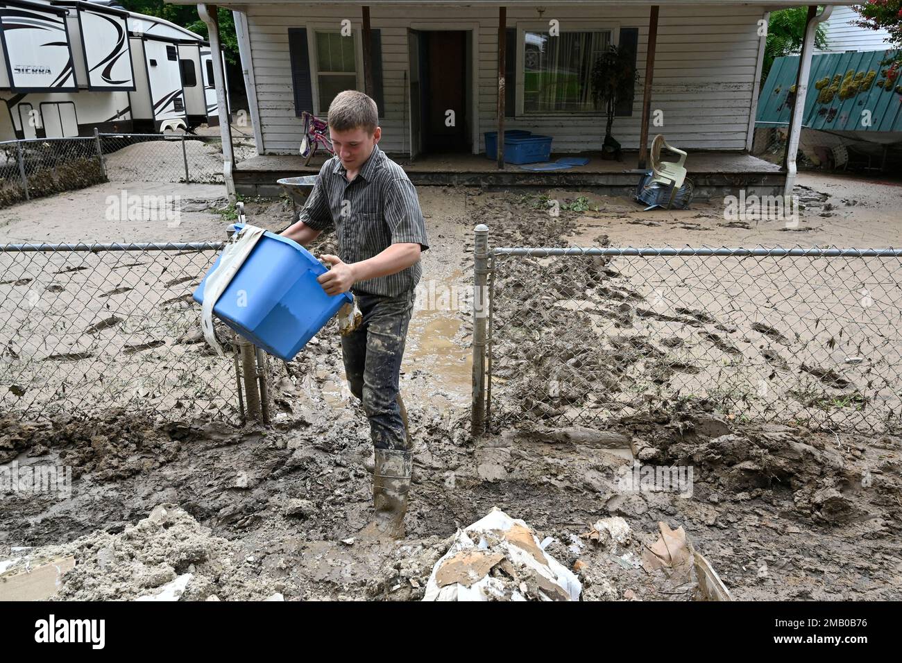 Members of the local Mennonite community remove mud filled debris from