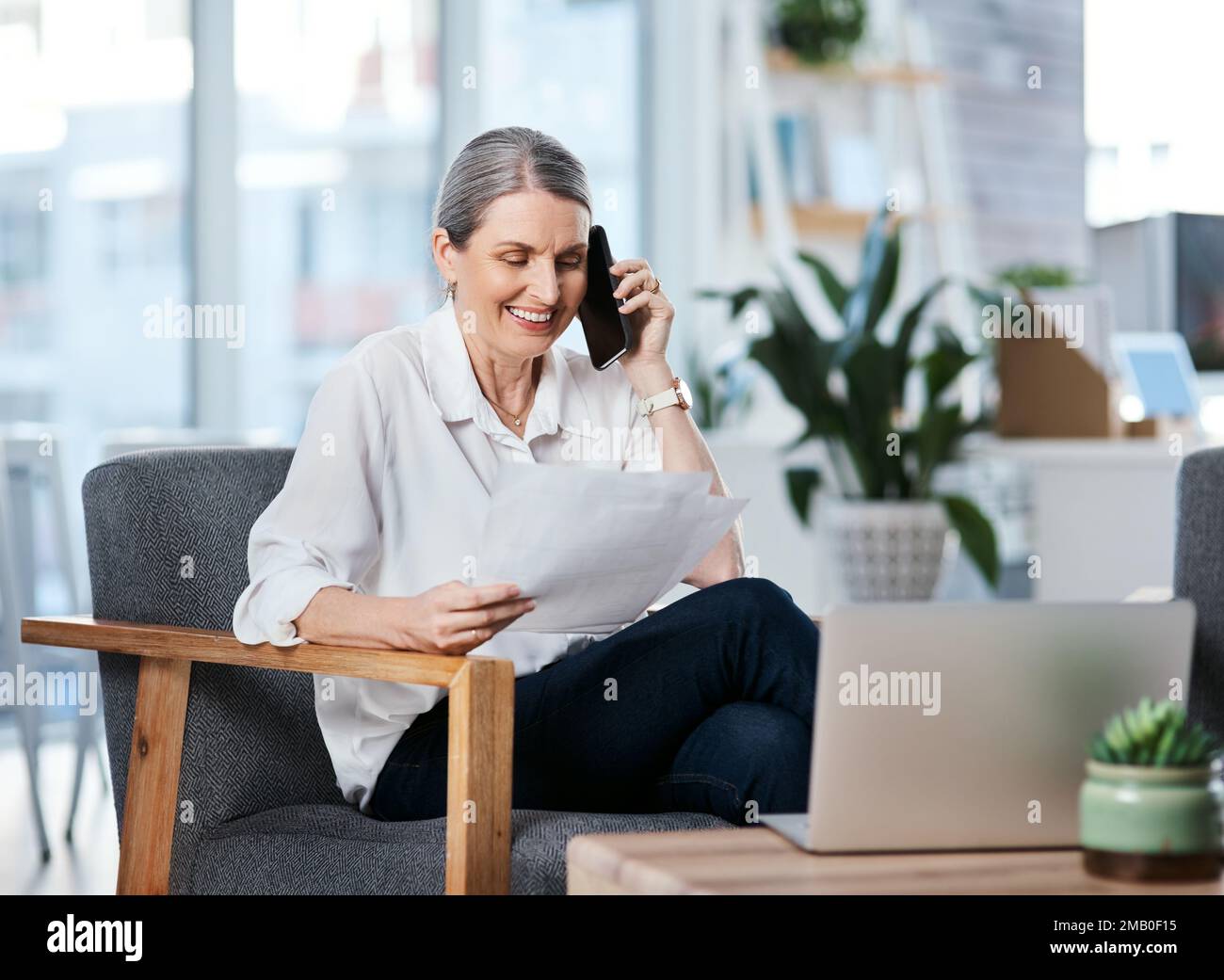 Happy mature woman calling hi-res stock photography and images - Alamy