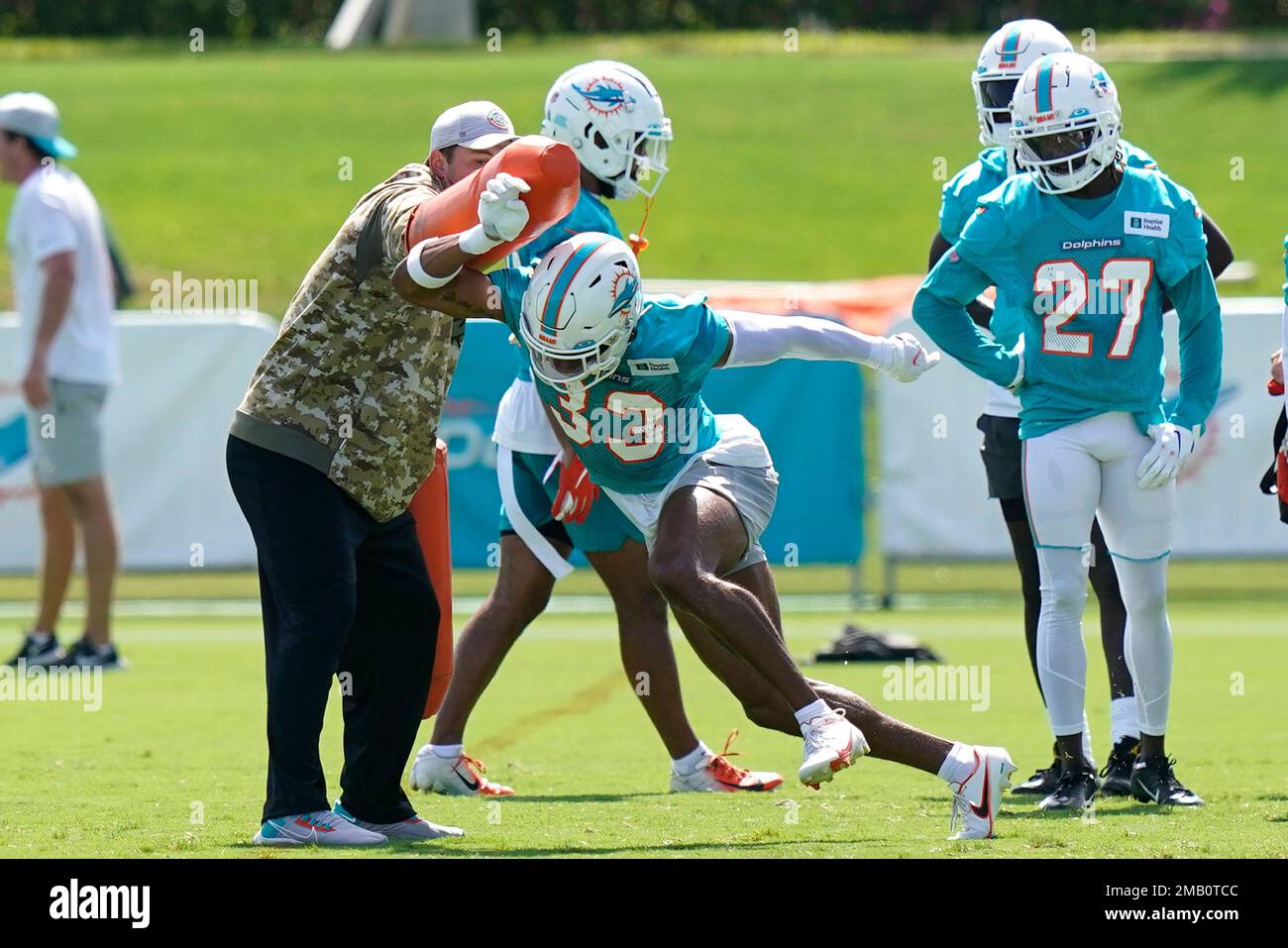 Miami Dolphins cornerbacks Elijah Hamilton, left, 33, and Trill