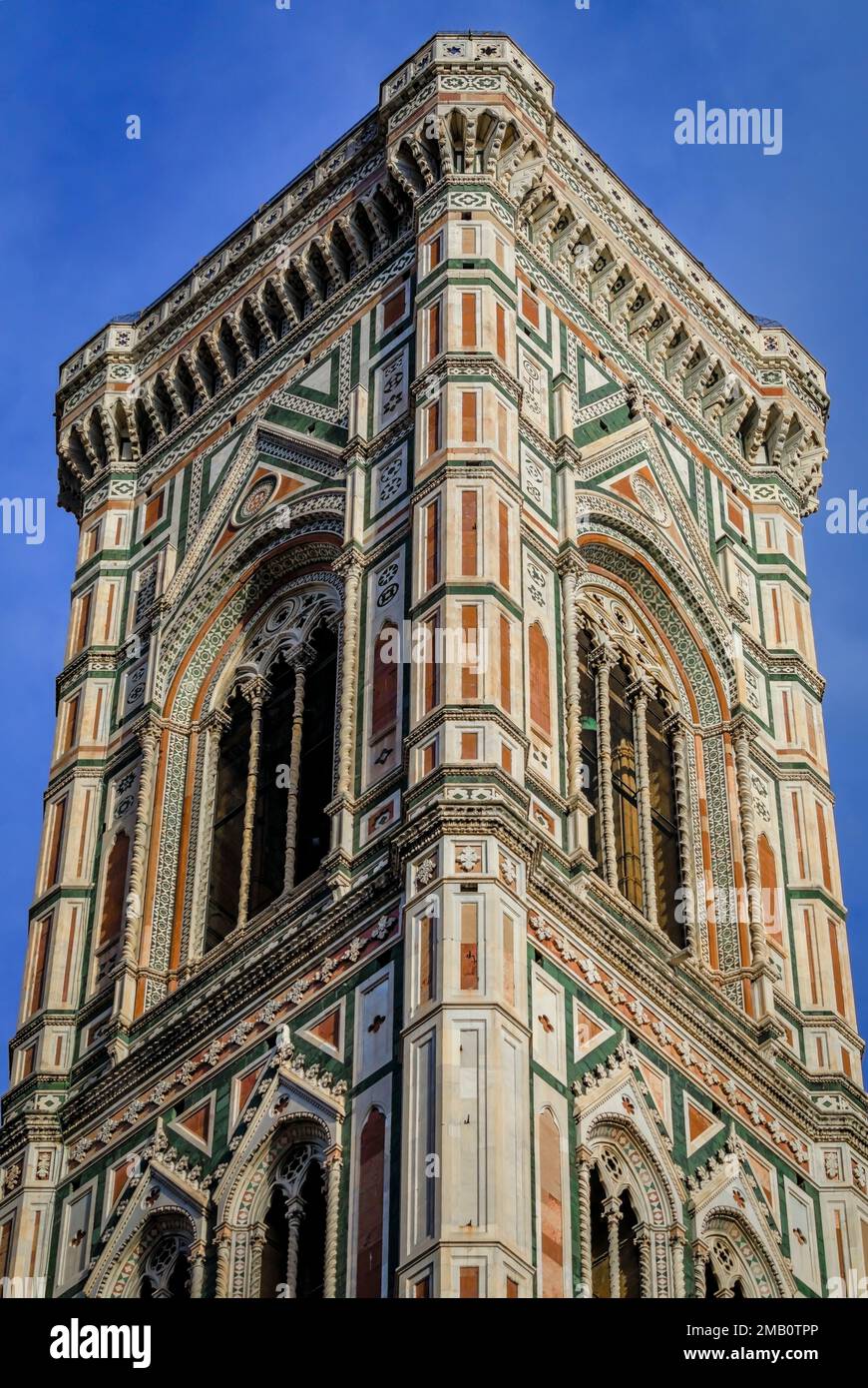 Colored marble facade of Giotto Campanile bell tower in the Duomo Cathedral or Cattedrale di Santa Maria del Fiore complex in Florence, Italy Stock Photo