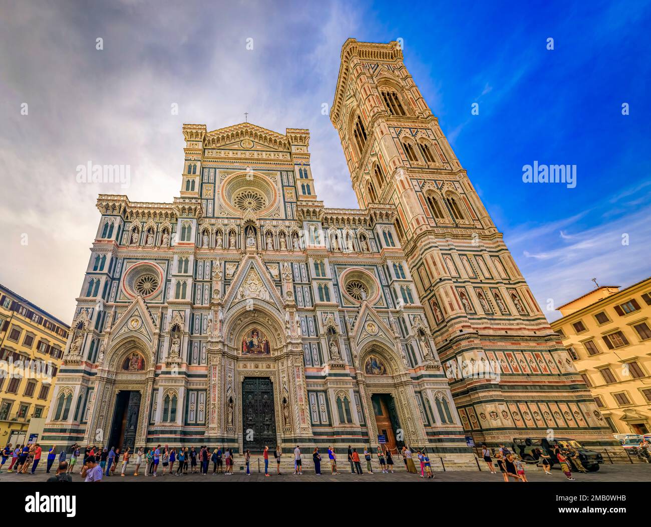 Florence, Italy - June 03, 2022: Duomo Cathedral or Cattedrale di Santa Maria del Fiore with colored marble facade and Giotto Campanile bell tower Stock Photo