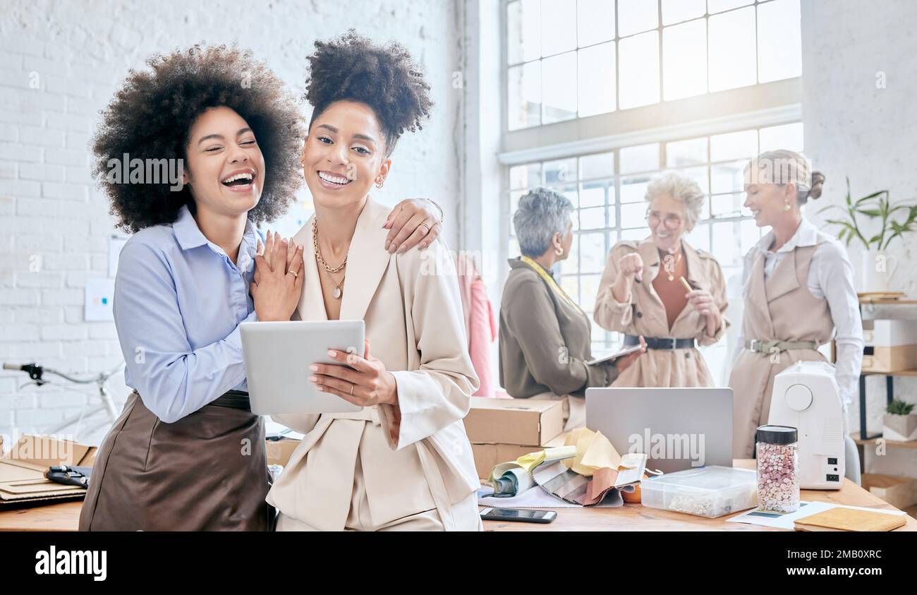 Teamwork, tablet and laugh with a business black woman and colleague joking in their office for design. Collaboration, fun and creative with designer Stock Photo