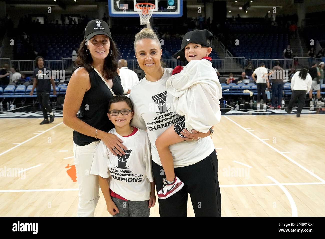 Las Vegas Aces head coach Becky Hammon, center, poses with her family