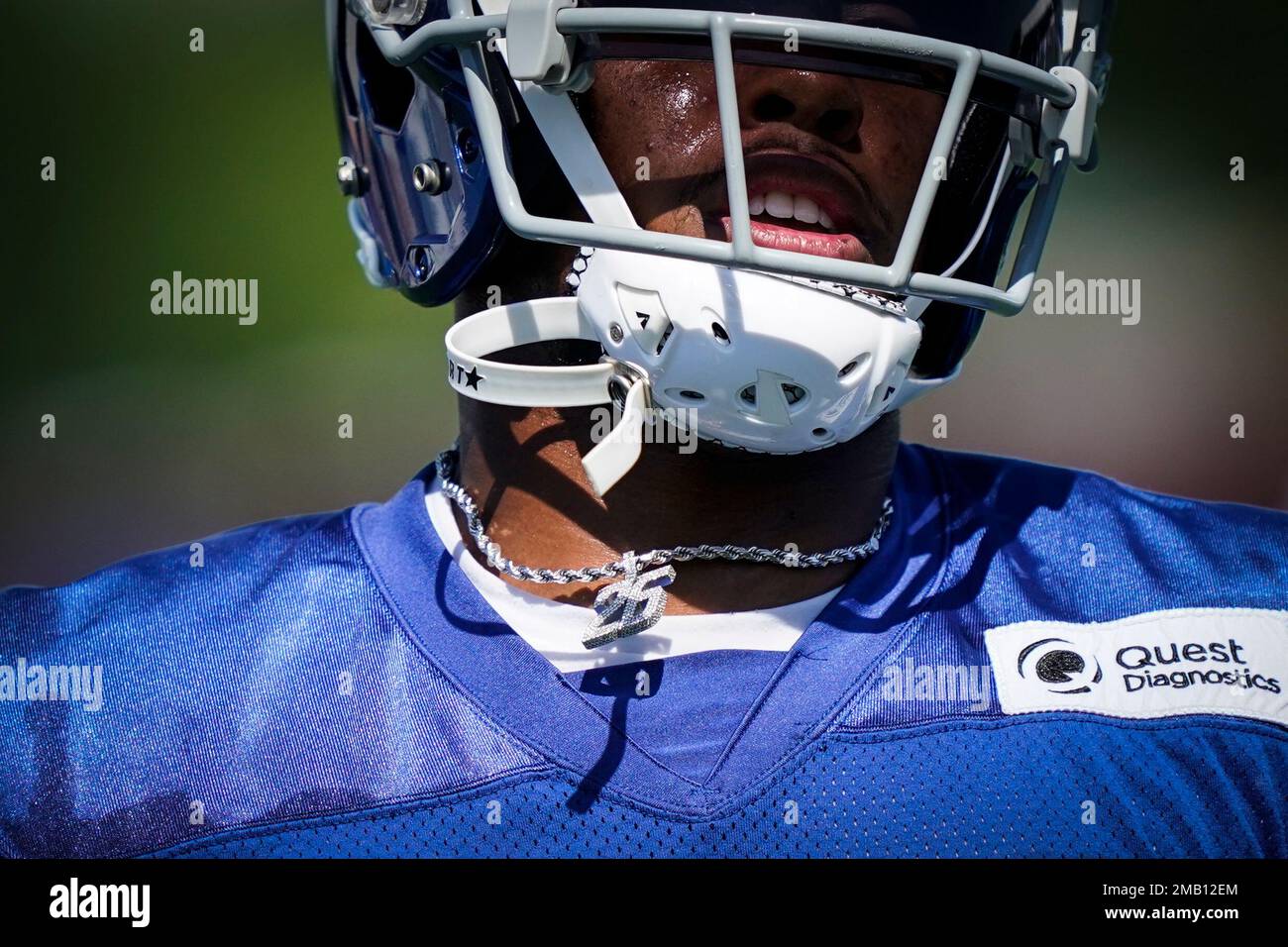 New York Giants running back Saquon Barkley wears a bejeweled number 26