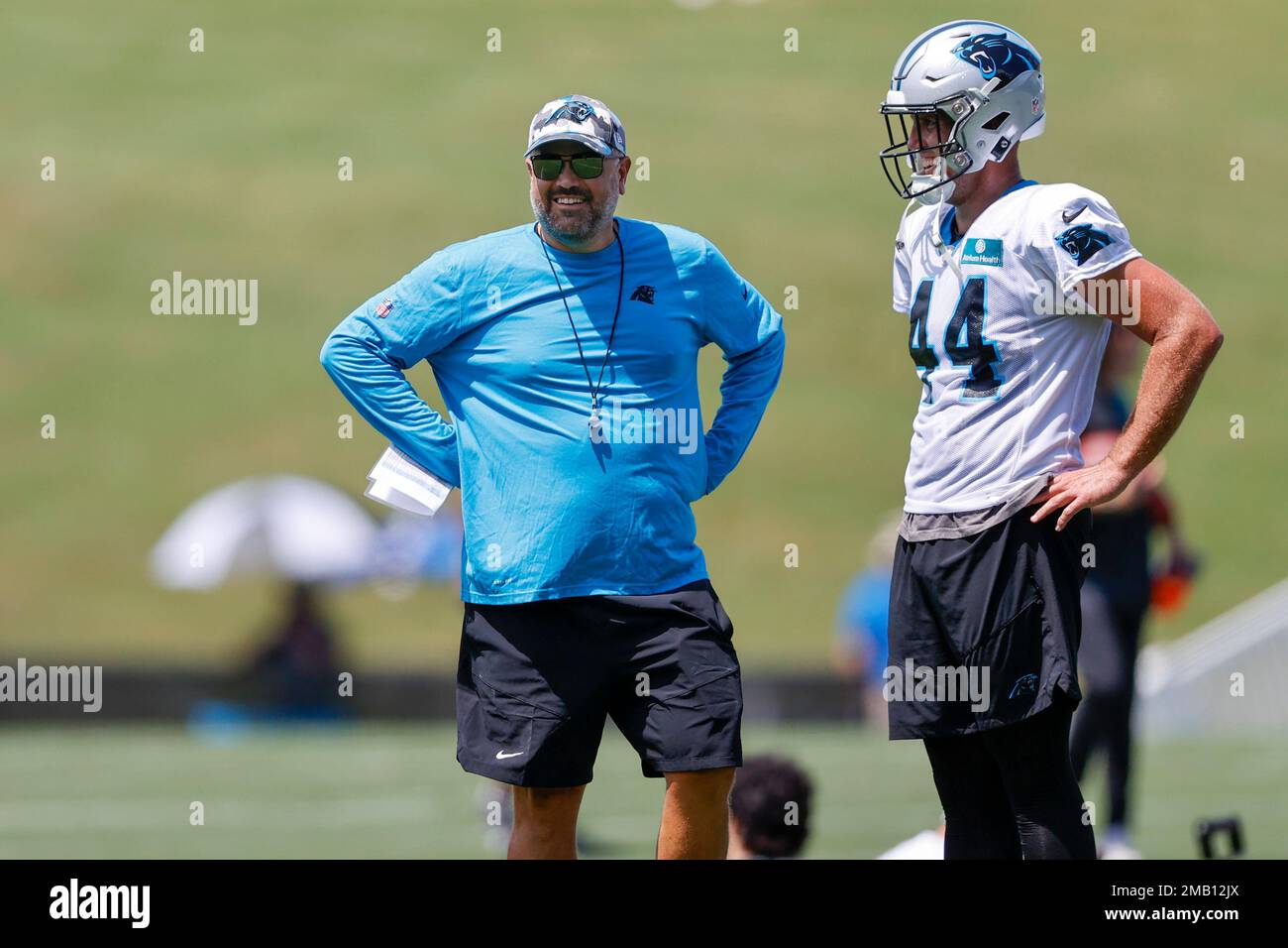 Carolina Panthers head coach Matt Rhule, left, talks to long snapper JJ  Jansen during the NFL football team's training camp at Wofford College in  Spartanburg, S.C., Wednesday, July 27, 2022. (AP Photo/Nell