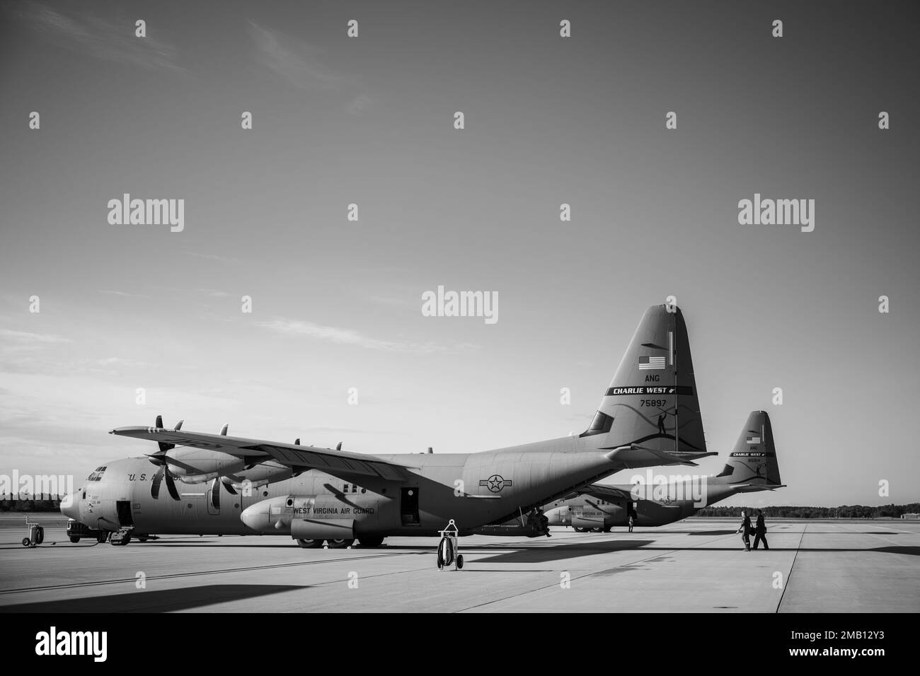 U.S. Air Force aircrew from 130th Airlift Wing, McLaughlin Air National Guard Base, Charleston, West Virginia, walk to a C-130J Hercules aircraft on the flightline during Agile Rage 22 at Alpena Combat Readiness Training Center in Alpena, Mich., June 9, 2022. Agile Rage 22 is a National Guard Bureau-led exercise that provides realistic training opportunities, mimicking current and future combat environments dictated by the National Defense Strategy. Stock Photo