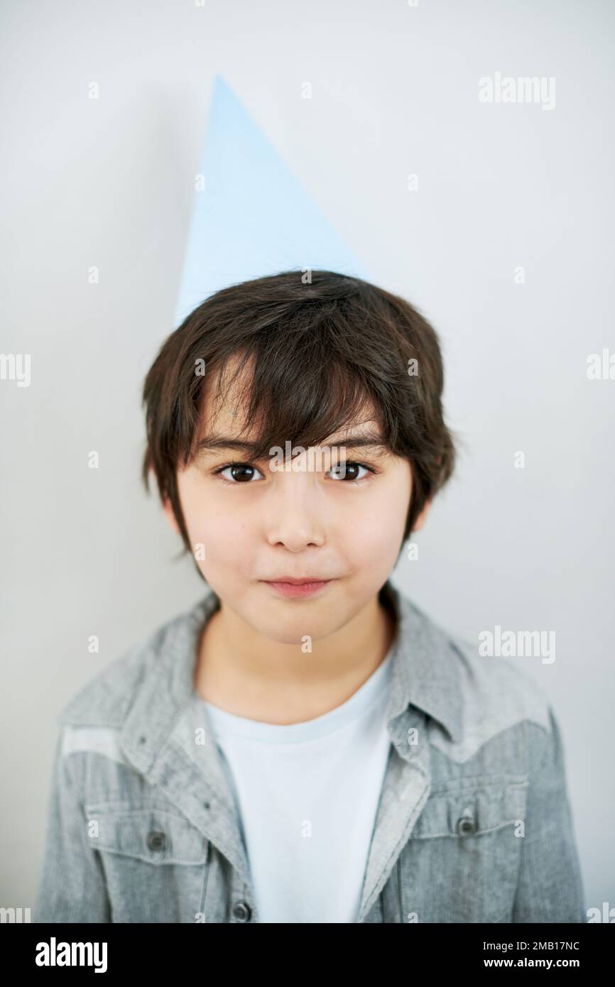 Its my birthday and were having a party. an adorable little boy wearing