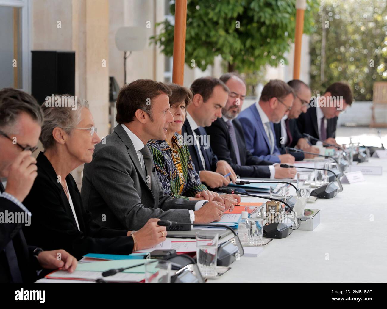 French President Emmanuel Macron, 3rd left, is flanked by French Prime