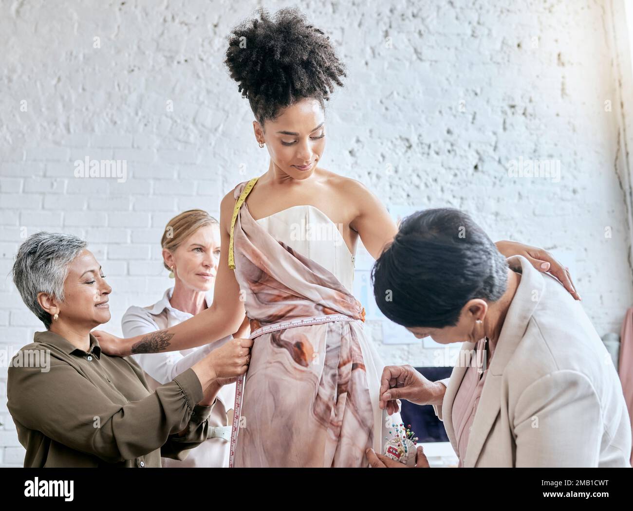 Designer women, model and fitting dress for focus, design or teamwork