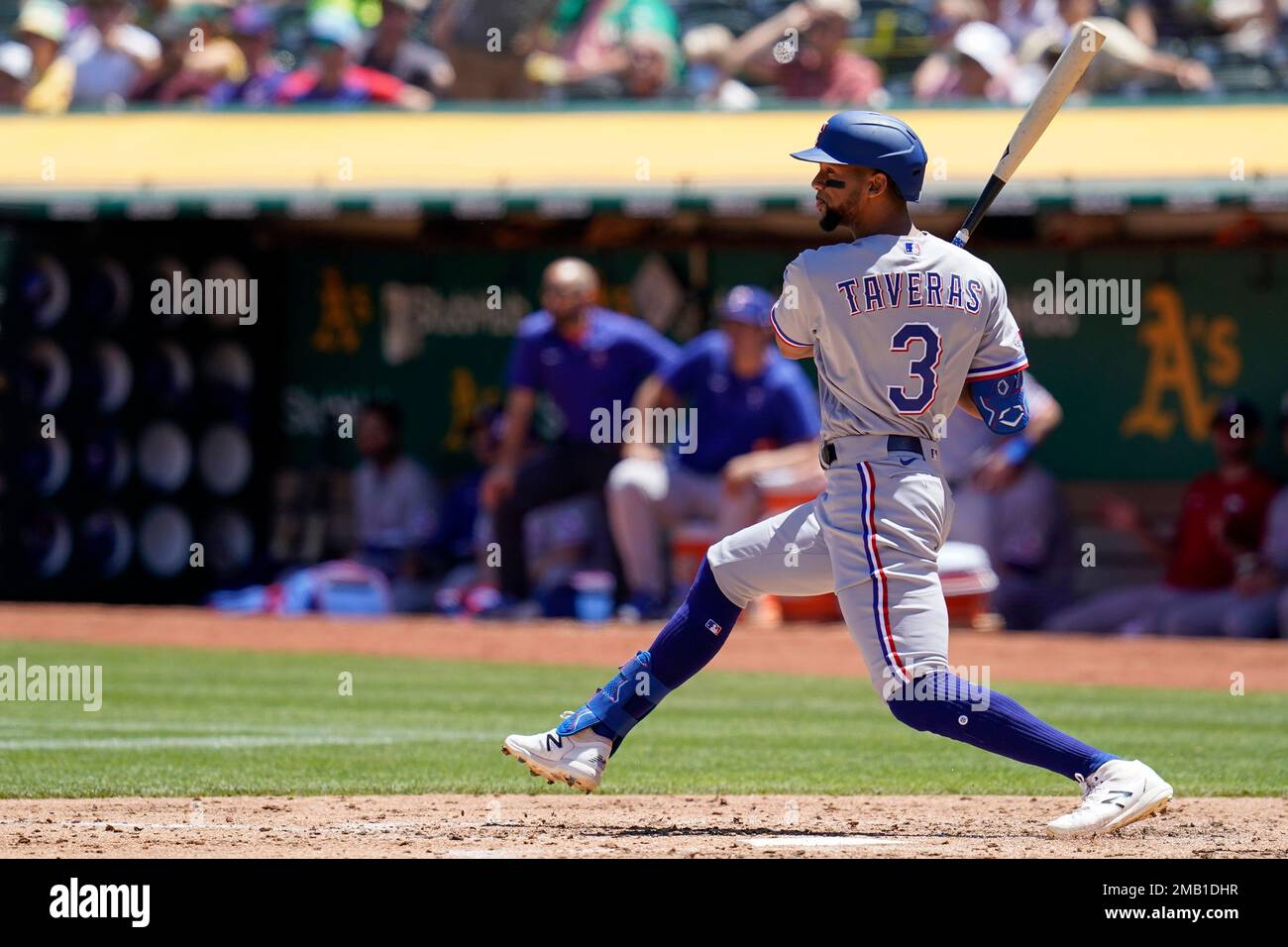 Texas Rangers' Leody Taveras hits an RBI-single against the