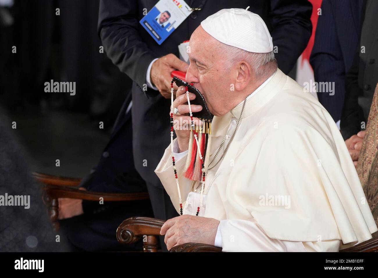 Pope Francis meets the Canadian Indigenous people as he kisses an ...