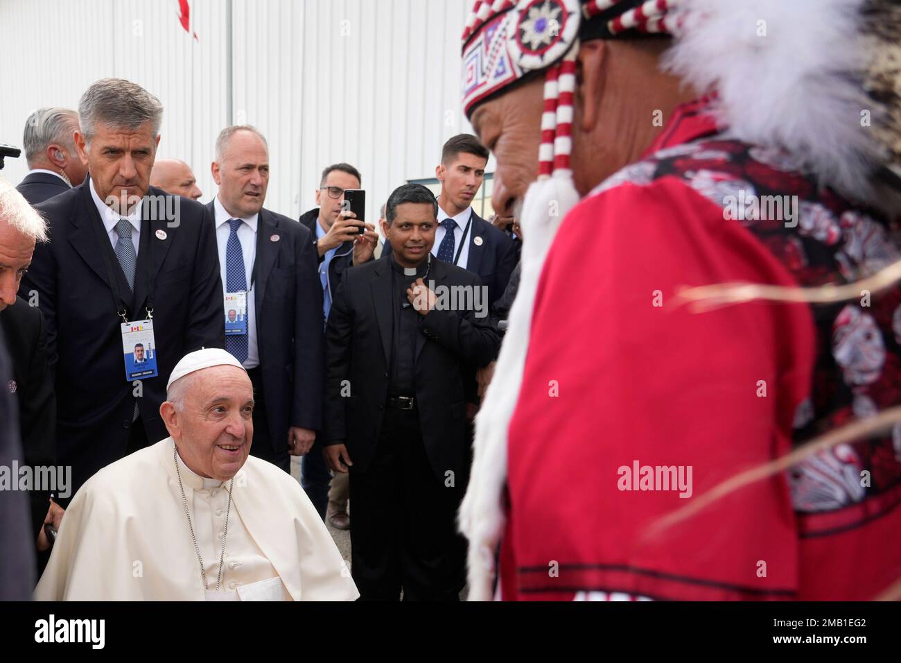 Pope Francis, left, meets the Canadian Indigenous people as he arrives ...