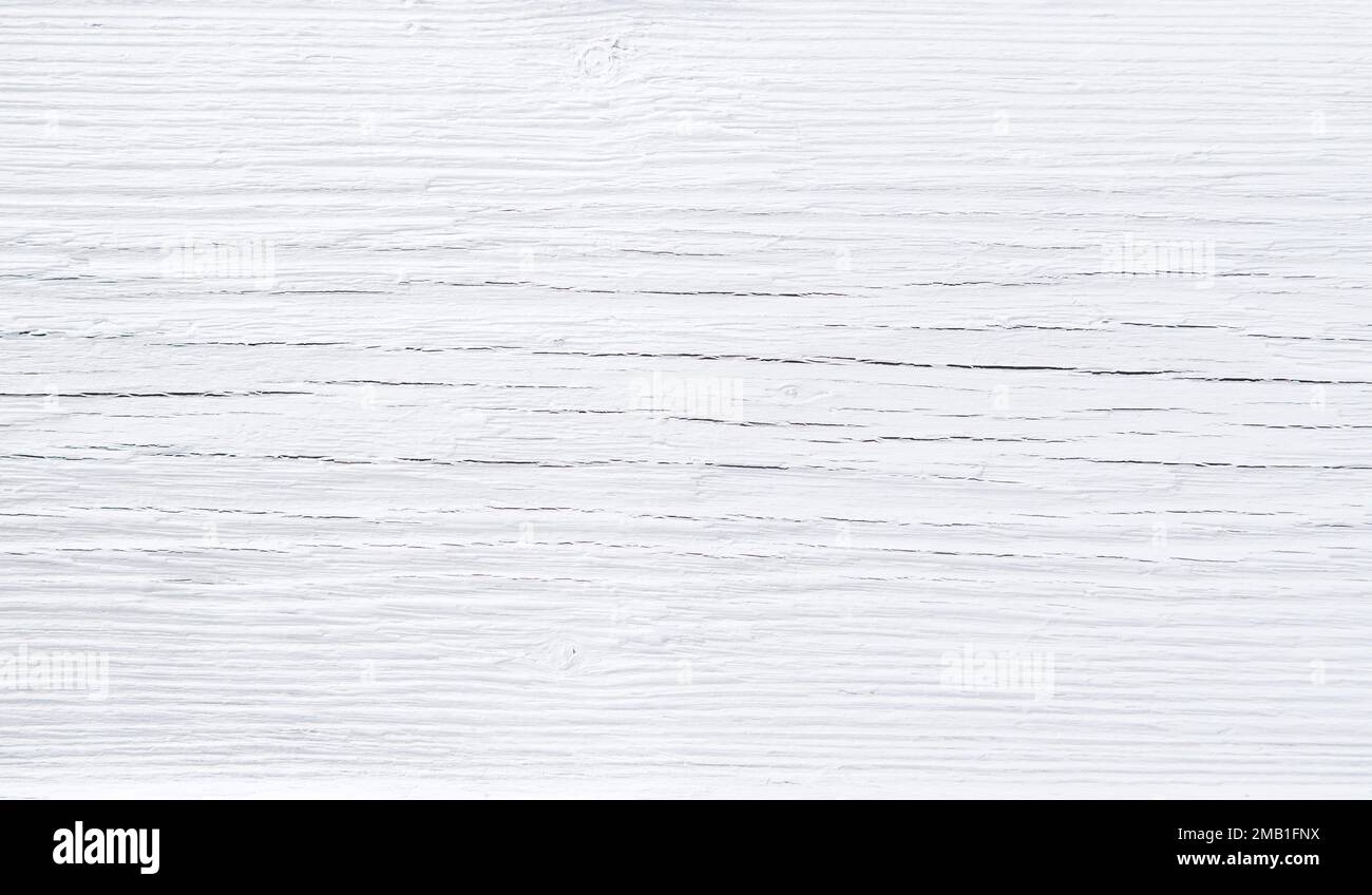 White paint on cracked wood desk background texture pattern Stock Photo