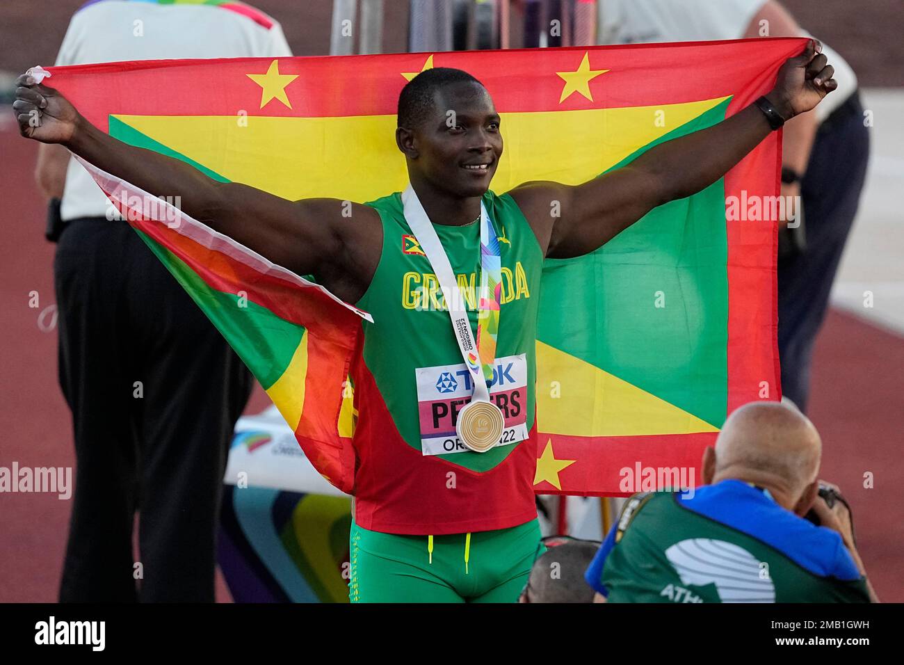 Gold medalist Anderson Peters, of Grenada, celebrates after the men's