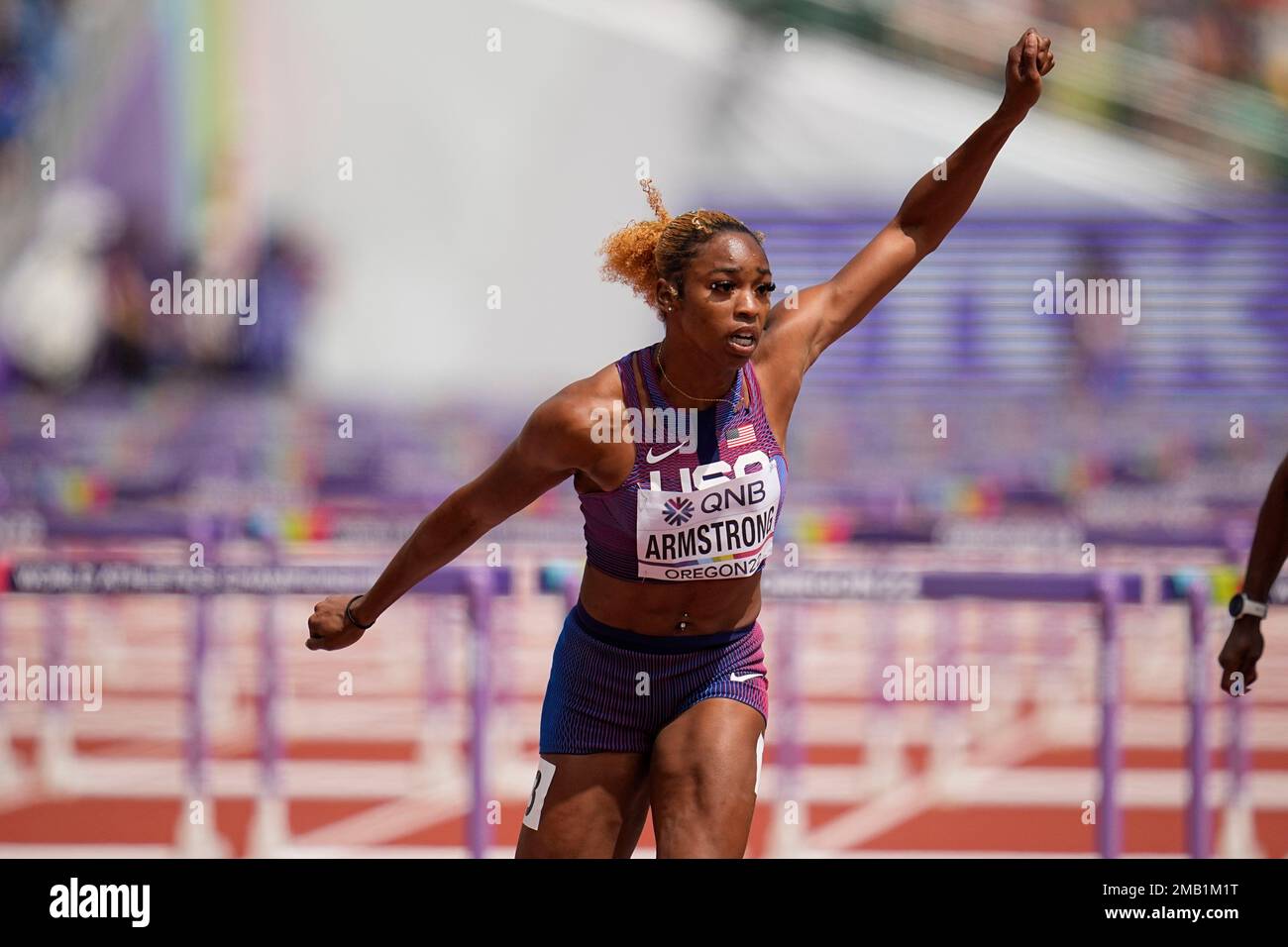 Alia Armstrong, of the United States, wins a heat in the women's 100