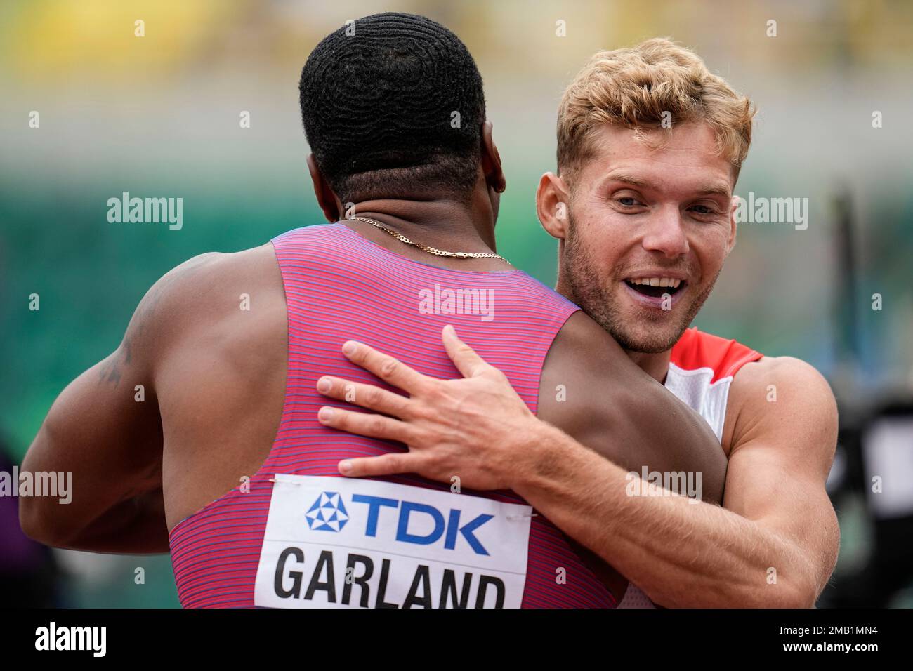 Kyle Garland, of the United States, embraces Kevin Mayer, of France